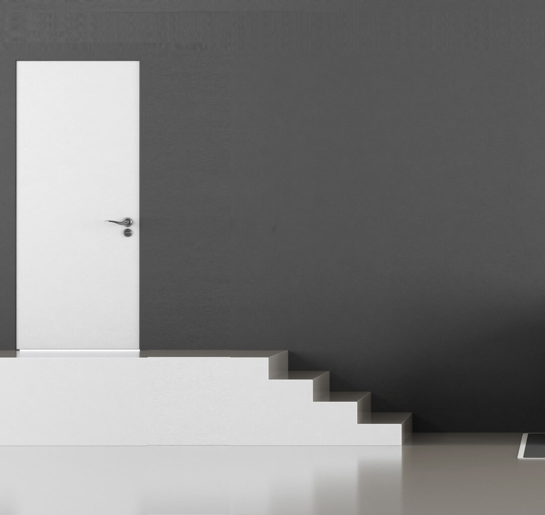 A minimalist monochromatic room including a white door.