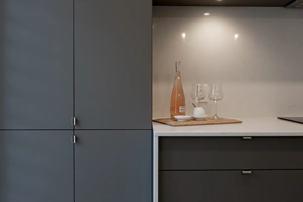 View of a matte finish cabinet with drawer and rosé wine finish